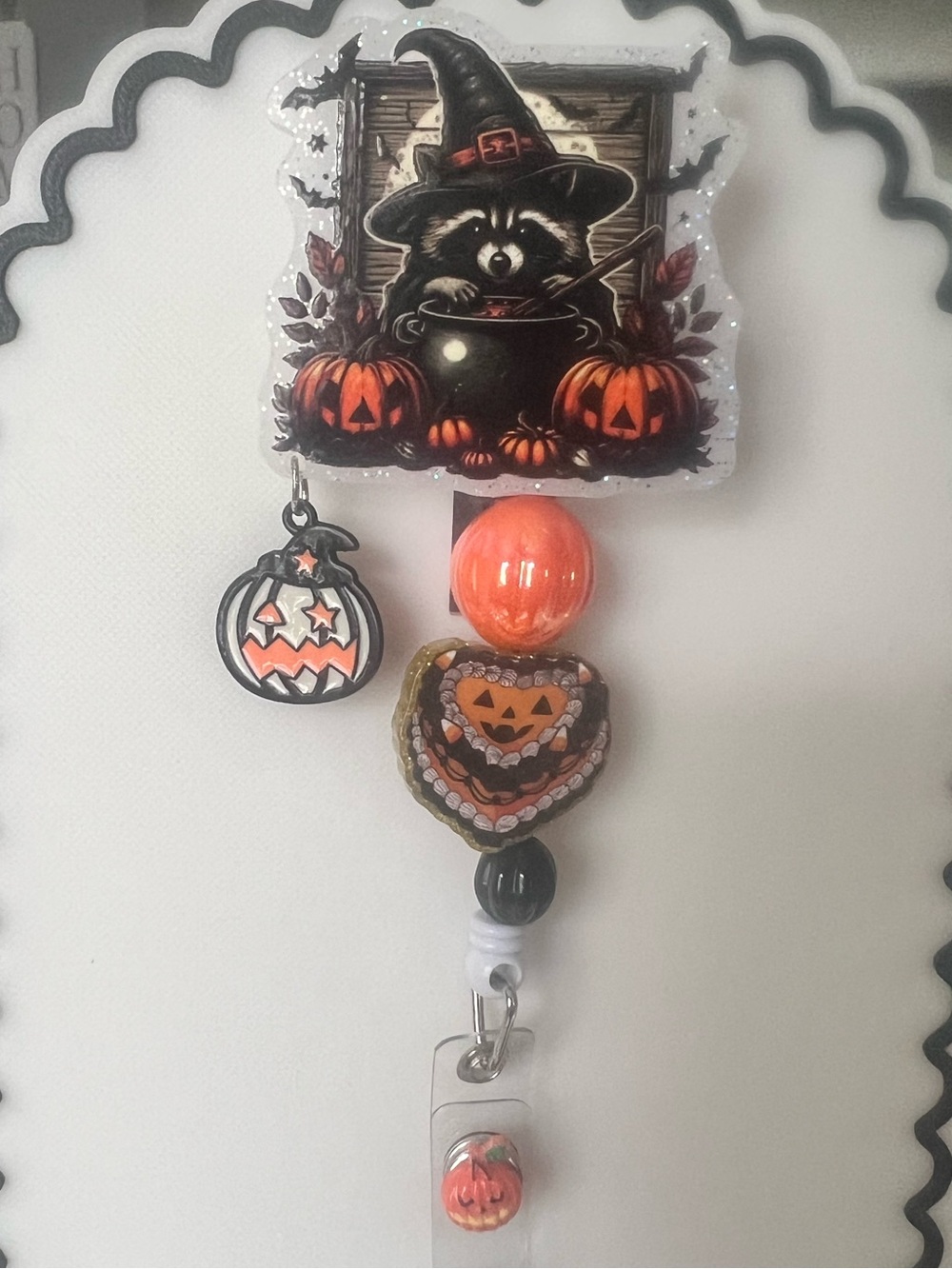 Handcrafted Halloween Raccoon Badge Reel - Orange & Black